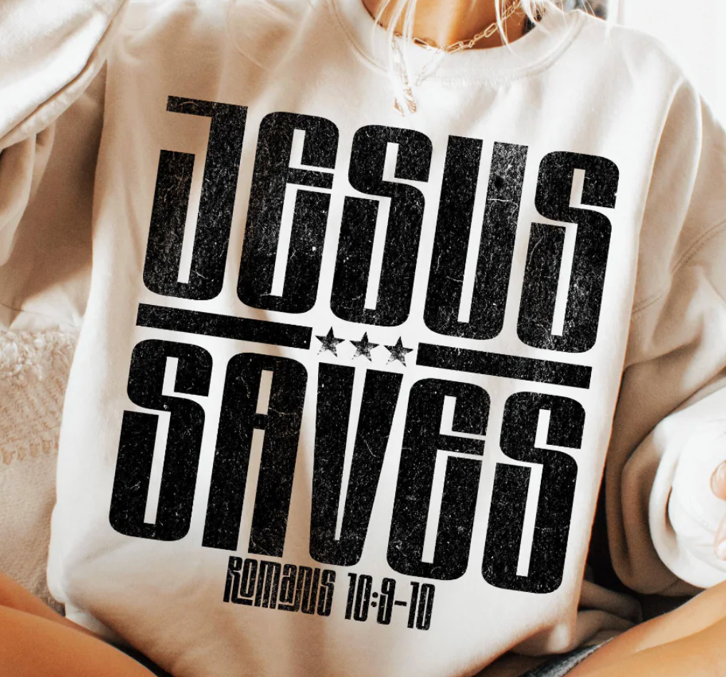 White sweatshirt with 'JESUS SAVES' text andbiblical reference on a person wearing it.