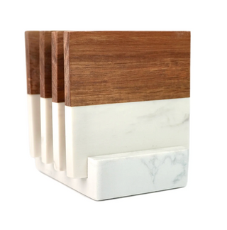 Two wooden and marble coasters on a holder with a white background