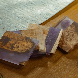 Close-up of epoxy coasters with natural wood patterns.