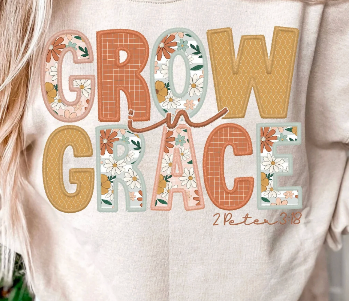 Text 'GROW GRACE' with floral designs on a white shirt.