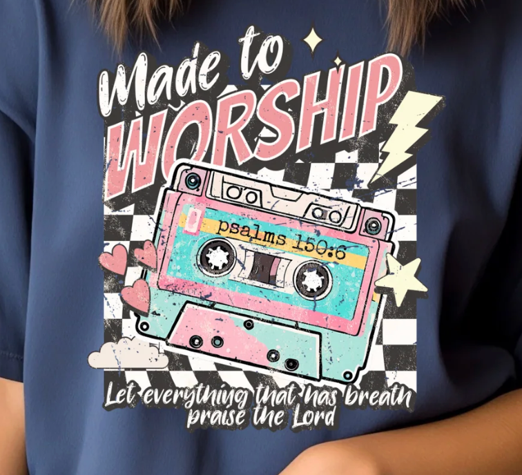 Navy blue t-shirt with 'Made to Worship' design featuring a cassette tape and text.